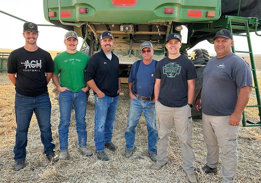Three generations of the Goetz family and their harvest crew getting ready to start the day’s work near Hartline in Grant County.  Pictured, from left, are Caden Correia, Jared Goetz, Kevin Goetz, Les Goetz, Luke Goetz, and Mike Correia.