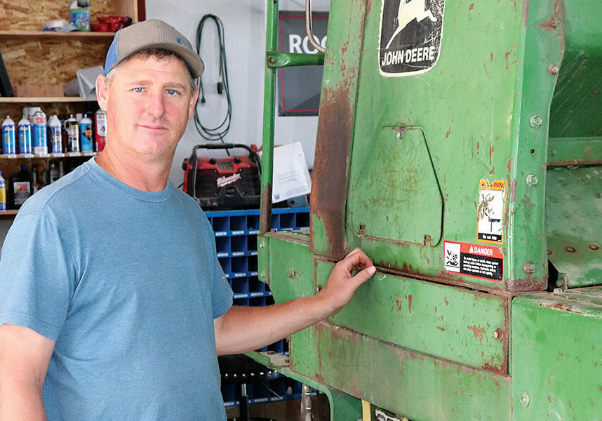 Washington State University Extension Agent Aaron Esser is shown with a John Deere drill donated to the Wilke Research Farm by a local farmer. Esser and his crew will perform repairs and upgrades and put it to work.